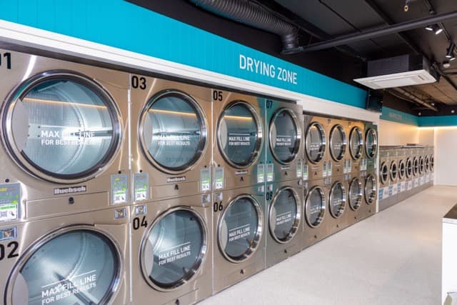 Numbered stacked dryers along the drying zone wall at the Spakleen Werribee laundromat