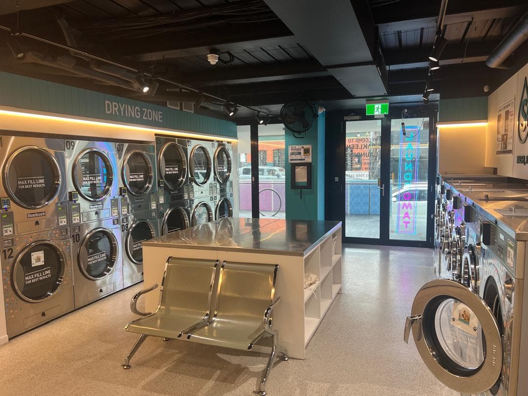 Stacked dryers in the drying zone at the Spakleen St Kilda laundromat
