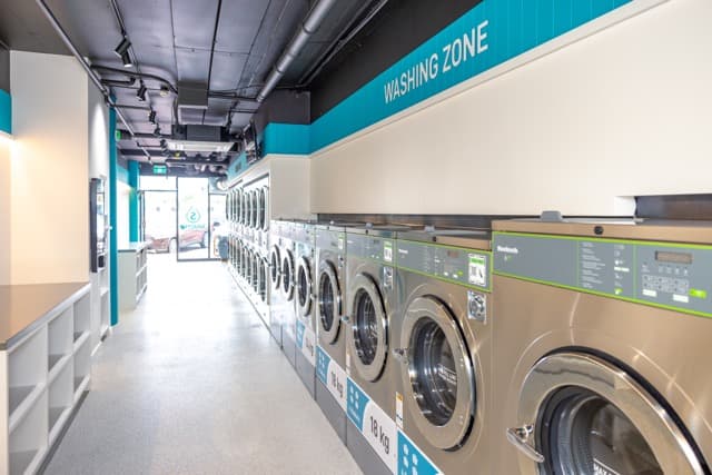 Washing zone at the Spakleen Werribee laundromat, with large-capacity machines down both walls